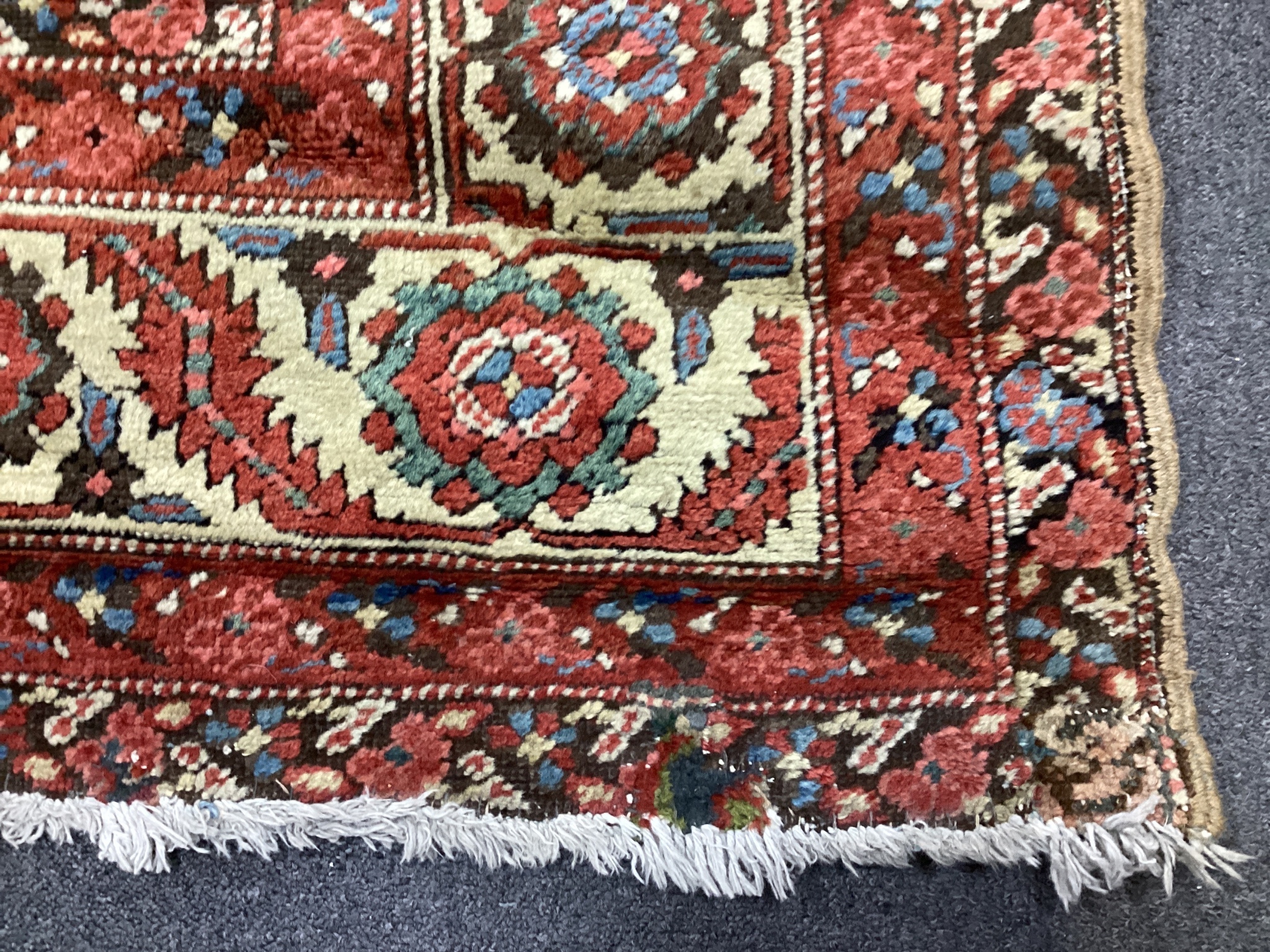 A North West Persian brick red ground carpet, 340 x 216cm